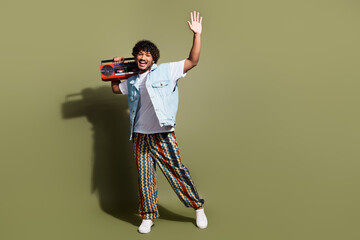 Full body photo of attractive young man dance wave hand boombox dressed stylish denim clothes...