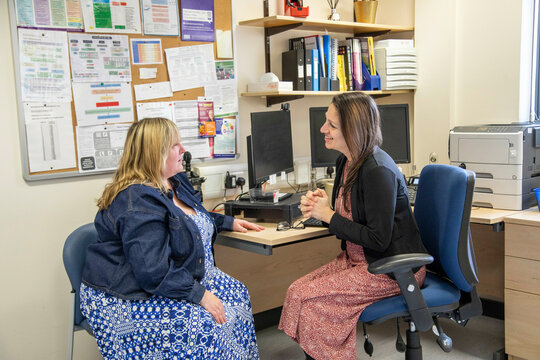 Doctor and patient in medical practice, UK
