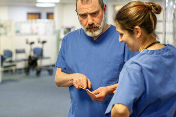 Medical professionals in scrubs discussing