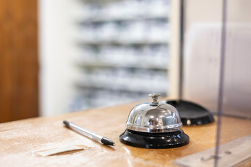 Reception desk with service bell and pen in a medical practice