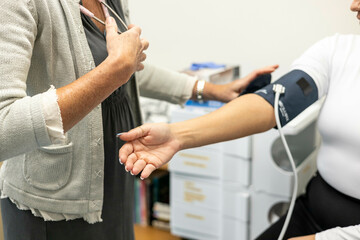 Nurse taking a patient's blood pressure
