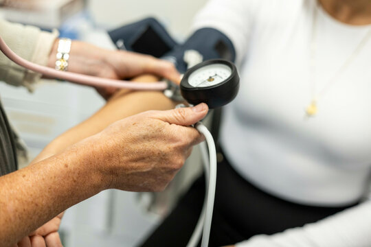 Nurse taking a patient's blood pressure