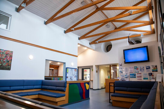 Interior of a modern waiting area with a television in a medical practice