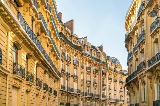 Sunlit Parisian street with classic architecture