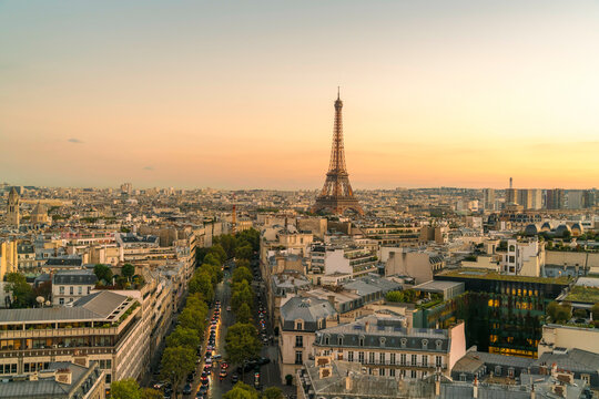 Sunset over the Paris skyline with the Eiffel Tower - Powered by Adobe