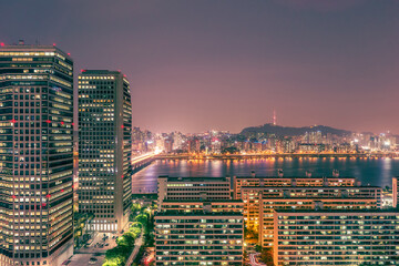 Seoul at night, viewed from Yeouido, a large island on the Han River in Seoul, South Korea, long...