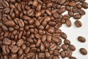 Close up photograph of the coffee beans with details. Coffee is one of the oldest traded...