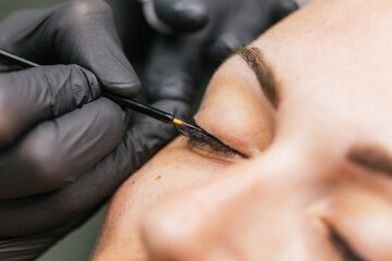 Precision eyeliner application in makeup session