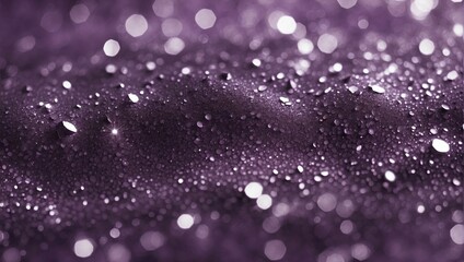 Close-up of purple glitter creating a rich, textured surface with a blurred, bokeh background. The sparkling particles capture light beautifully, producing a luxurious, enchanting visual effect