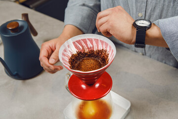 Barista Precisely Pours Boiling Water for V60 Coffee Extraction Monitoring Brew Time