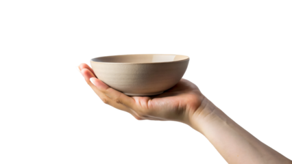 A woman's hand gently cradles a ceramic bowl