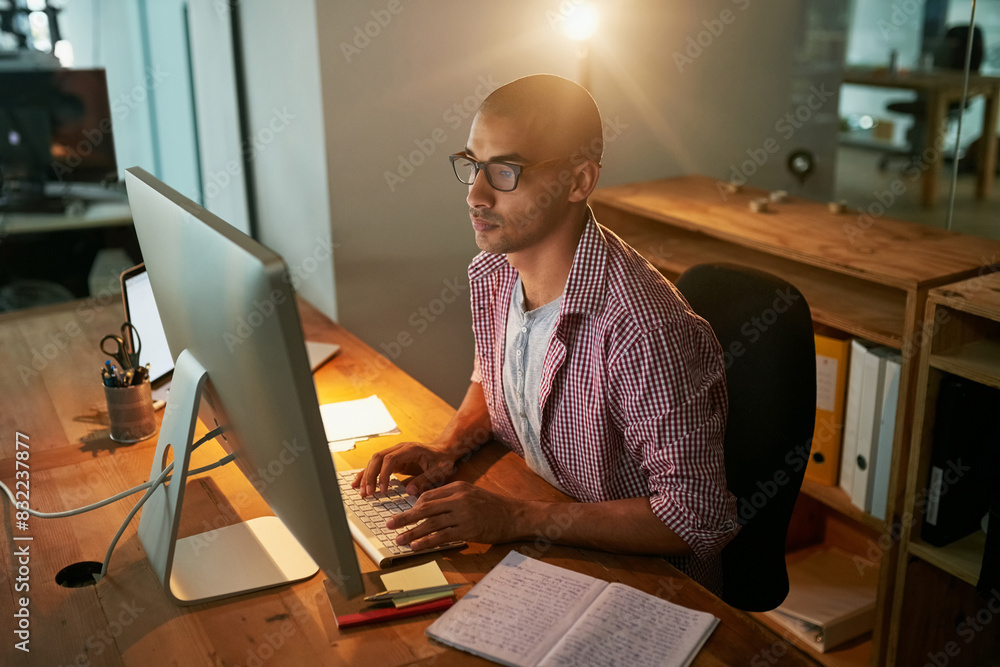 Aufkleber man, typing and computer in office at night as web designer for research, information and creative p