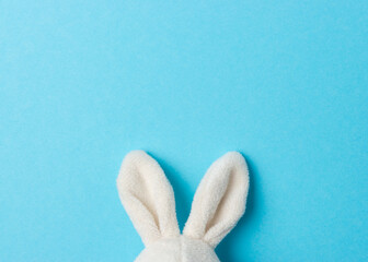 Easter bunny ears on blue background. Minimal Easter concept.