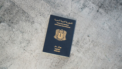 A close up snapshot of Syrian passport on concrete background