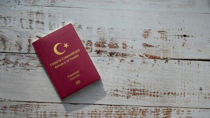 Republic of Turkey red passport isolated on woody background