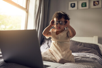 Portrait, child and laptop for video call, connection and development in bedroom. Girl, glasses and...