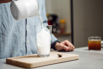 Creating Chilled Ice Latte at Home During Relaxation