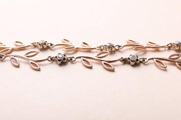 Female gold bracelet with flowers