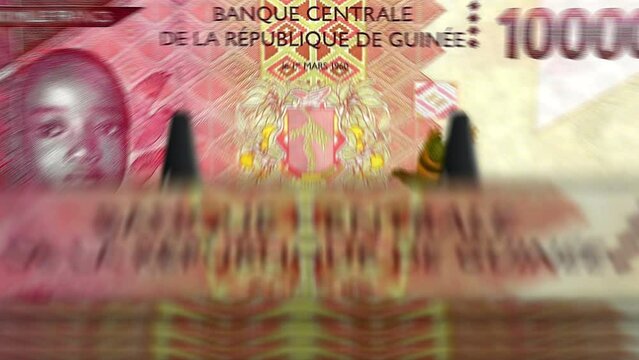 Guinea money Guinean francs counting machine with banknotes. Quick GNF 10000 currency note down rotation. Business and economy concept loopable and seamless background.