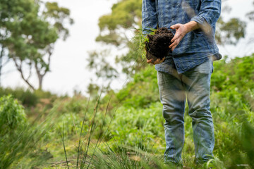 farmer holding soil looking at soil carbon in the america
