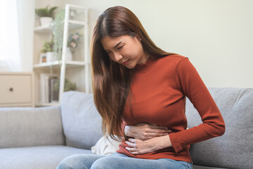 Flatulence ulcer, asian young woman, girl hands in belly, stomach pain from food poisoning, abdominal pain and digestive problem, gastritis or diarrhea. Abdomen inflammation, menstrual period people.