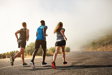Group, fitness and sport with running in outdoor by training, exercise and practice for marathon...