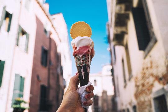 Fototapeta Delicious gelato or ice cream in waffle cone in Venice Italy.