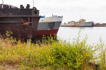 Baikal Lake. Old rusty ships at the pier in Port Baikal on summer sunny day