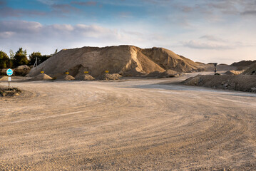 large mounds and piles of fractions of various stones in the quarry