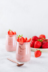 Mousse dessert of tofu and strawberries in glass cups. Lactose and sugar free. Vertical orientation.