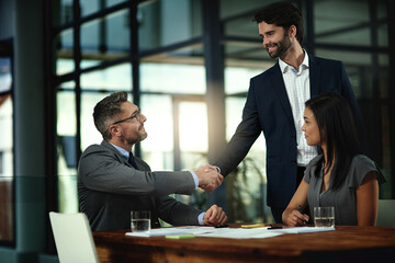 Business, men and shaking hands with collaboration in conference room for deal and partnership....