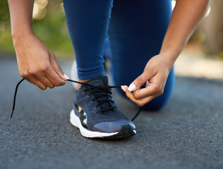 Hands, shoes and ready on road for fitness, exercise and run in the city. Person, sneakers and...