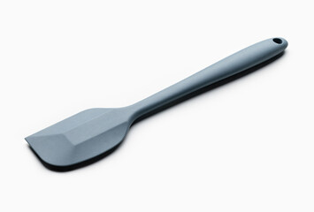 The food grade plastic spatula is grey in color. Kitchen utensils, close-up.