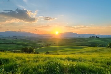 Picturesque sunset over a serene countryside with rolling hills and lush meadows