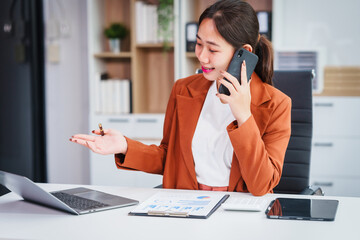 Asian businesswoman specializing in stock market and financial services, including roles as a loan...