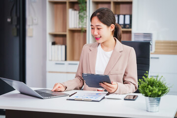 Asian businesswoman specializing in stock market and financial services, including roles as a loan...