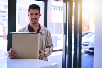 Fototapeta premium Portrait, box and delivery man with clipboard for package, shipping or online shopping. Export, ecommerce and courier person with smile for customer signature, supply chain or distribution service