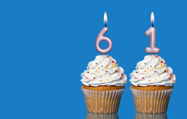 Birthday Cupcakes With Candles Lit Forming The Number 61