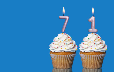 Birthday Cupcakes With Candles Lit Forming The Number 71