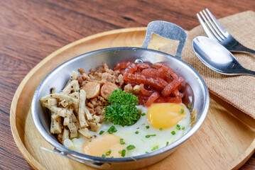 A delicious Japanese meal with rice, pork, and various side dishes.