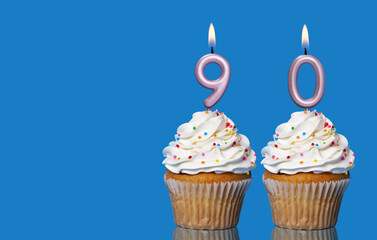 Birthday Cupcakes With Candles Lit Forming The Number 90