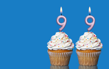 Birthday Cupcakes With Candles Lit Forming The Number 99