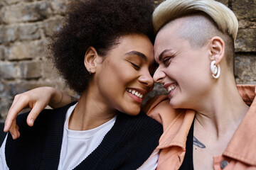 Diverse lesbian couple in cafe setting, enjoying each others company.