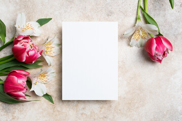 Wedding invitation or greeting card mockup with alstroemeria and tulips flowers, copy space for...