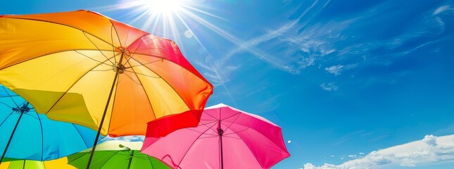 A vibrant, summer beach background with bright sun, blue sky, and colorful umbrellas.