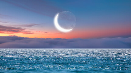 Ramadan Concept - Abstract background with Crescent moon over the sunset 