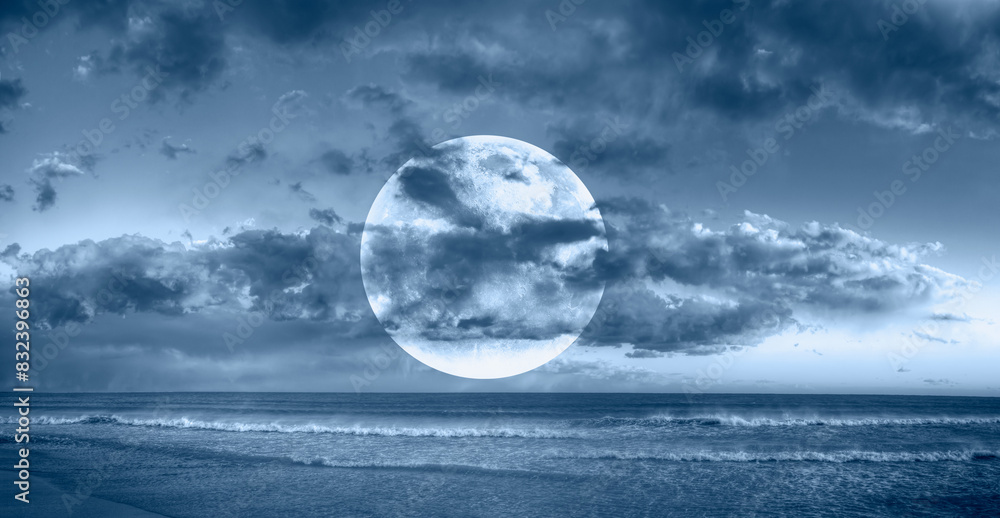 Poster night sky with full bright moon in the clouds 
