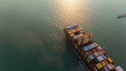 front view Cargo Container ship the ocean ship carrying container and running for import export...