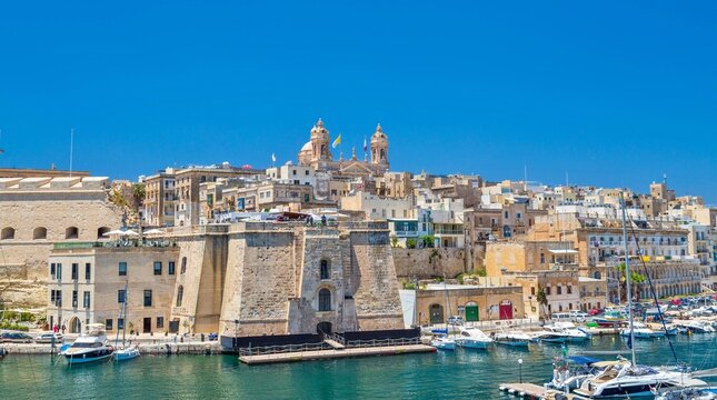 The Basilica of the Nativity of Mary rising over Senglea, and the Vittoriosa Yacht Marina, Valletta, Malta, Mediterranean