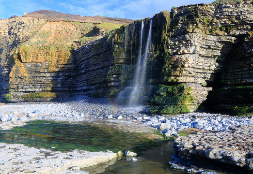 Waterfall at Cwm Bach, Traeth Bach Beach, near Southerndown, Glamorgan Heritage Coast, South Wales